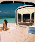 Instant Pop Up Screen Tent With Mosquito Net by beach; portable screen house canopy for patio, backyard; perfect for camping or outdoor hangouts.