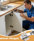 Man installing invisible cabinet hinges with soft close, stainless steel overlay hardware on kitchen cabinet door.