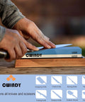 Person sharpening knife on Dual Sided Whetstone Knife Sharpener Kit 1000/6000 Grit With Non Slip Base And Fix Stone