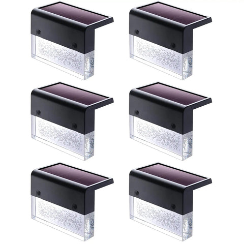 Six black and transparent Solar Deck Lights 3000K Warm White Color Changing Outdoor Fence Lights for steps and rails.