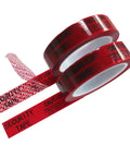 Angled view of two red tamper-evident security tape rolls, 1in wide, printed CAUTION/SECURITY TAPE text