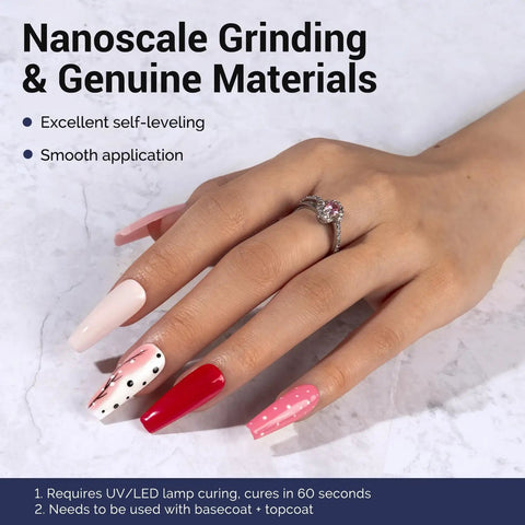 Hand with four pink and red nails using Fleurwee Plant Based Gel Nail Polish Kit Four Piece Set With 21 Pink Shades Hema Free