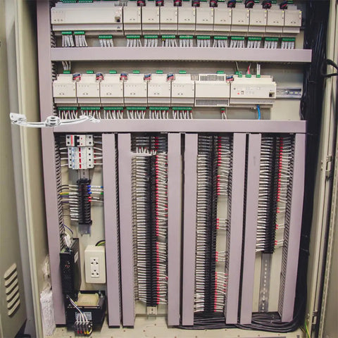 Electrical control panel with wiring details and components inside an industrial cabinet