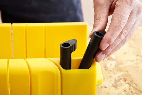 Close-up of yellow Saw Storage Miter Box With Saw Aluminum Construction All In One 11.81 Inch Length With storage slots