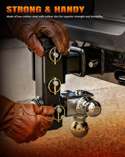 Person adjusting 30 Piece Heavy Duty Lynch Pin Assortment Kit with zinc plated steel pins on a trailer hitch, universal fit for farm implements.