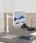 Heavy Hitter Single Monitor Desk Mount With Smooth Tilt And Swivel For Screens Up To 32 Inch Or 38 Inch Ultrawide Displays in white finish, mounted on a desk.