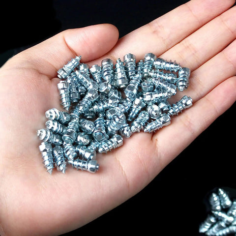 Heavy Duty Screw In Ice Traction Studs For Hunting Boots Snow Bikes Lawn Tractors And Atv Utv displayed in a hand, showcasing grippy steel material.