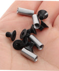 Close-up of four-piece knife handle rivet screw kit with metal sleeves and black fasteners