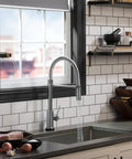Modern kitchen with Touch2O faucet featuring VoiceIQ Activation Module for Touch2O Kitchen Faucets Compatible with Alexa and Google Assistant.