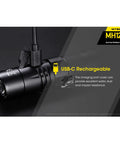 MH12V2 Plus NL2150 1200 Lumen USB Rechargeable Tactical Flashlight with USB-C cable connected, rugged design