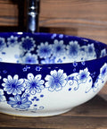 USZWBY Vessel Sinks Blue and White Porcelain Bathroom Basin Sink round ceramic washbasin with floral design.