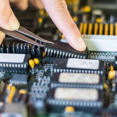 Inserting chip into DIP IC Socket Adapter on PCB, 2.54mm pitch, 6-pin layout, reusable chip socket, easy IC replacement, durable connector.