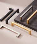 Various colored cabinet handles, including Matte Black Cabinet Handles Set Of 10, 5 Inch Center To Center, on display.