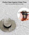 Tough As Nails Pop Up Tub Stopper With Integrated Hair Catcher And Fine Mesh Strainer showing stainless steel drain plug in water.