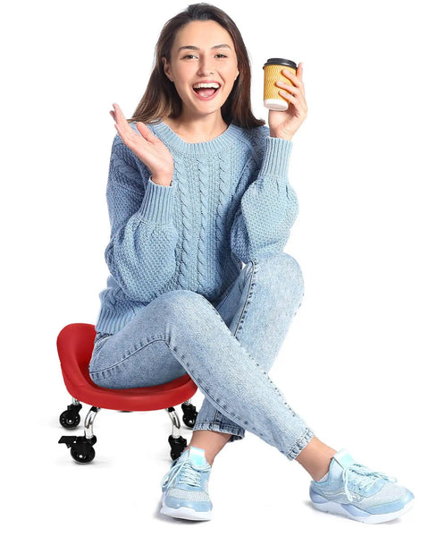 Woman sitting on a red Rolling Stool With Backrest 450 Lbs Weight Capacity PU Leather Seat All-Day Comfort, smiling and holding coffee.