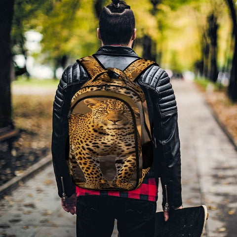 Person wearing the Wild Leopard Print Backpack For Everyone, Large Capacity Daypack, durable polyester, walking outdoors