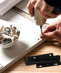 Installation of Beefy Heavy Duty Spring Loaded Lift Up Hinges for Cabinets and Folding Sofas with tools and screws visible