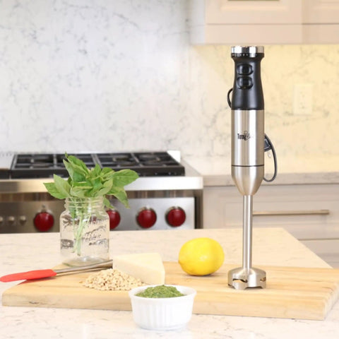 Powerful Immersion Blender With Stainless Steel Shaft And Variable Speed Control To Handle Tough Ingredients on kitchen countertop with ingredients.