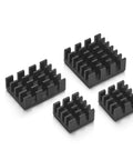 Four black aluminum heat sinks designed for Raspberry Pi 4 Model B cooling included in the starter kit.