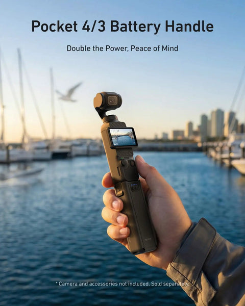 Person holding Extended 5000mAh Battery Grip For DJI Osmo Pocket 4 And 3 Xtra, cityscape and marina in background
