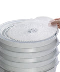 Smooth Operator Digital Electric Food Dehydrator With Stackable Trays, hand placing tray on top, ideal for jerky and herbs.