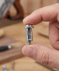 Beefy Hollow Wall Anchors M4 Kit For Drywall Fixings With Petal Expansion Nuts Zinc Plated Carbon Steel 50 Sets Universal Fit For Bathrooms Kitchens Outdoors Built To Last And Ready To Install. M4 zinc-plated hollow wall anchor held between fingers