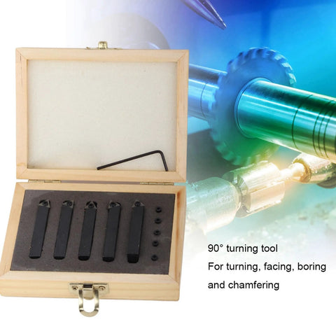 Front view of a wooden tool case with five carbide turning tools set in foam slots