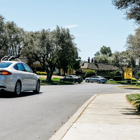 Slow Down Signs With H Stake 16x12 Inches Kids And Pets At Play Double Sided Street Safety Signs installed near neighborhood