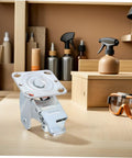 Heavy Duty Swivel Caster Bracket With Parking Brake on a workbench, showcasing silver steel frame and robust design.