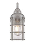 Rezner One Light Outdoor Wall Fixture in galvanized steel with clear seeded hand blown glass, front view showing bulb and design details.