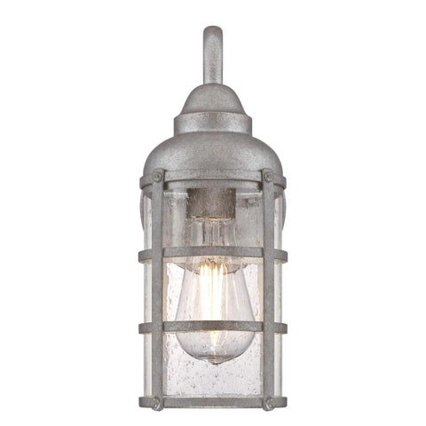 Rezner One Light Outdoor Wall Fixture in galvanized steel with clear seeded hand blown glass, front view showing bulb and design details.
