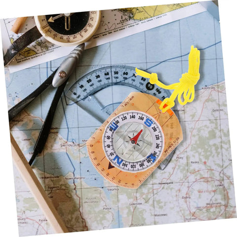 Orienteering Compass For Hiking And Camping Trail Ready Navigation Tool on map with yellow cord and protractor