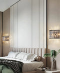 Modern K9 Crystal Wall Sconce Flush Mount LED Light With Matte Black Finish And Two Elegant Fan Shades in bedroom setting.