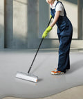 Person using an 18-inch self leveling spiked roller for concrete and epoxy floors, bubble breaker screeding tool