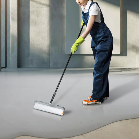 Person using an 18-inch self leveling spiked roller for concrete and epoxy floors, bubble breaker screeding tool