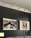 Gold Finish LED 4 Light Track Lighting Kit With Rotatable Heads And Foldable Track Fixtures installed on modern ceiling