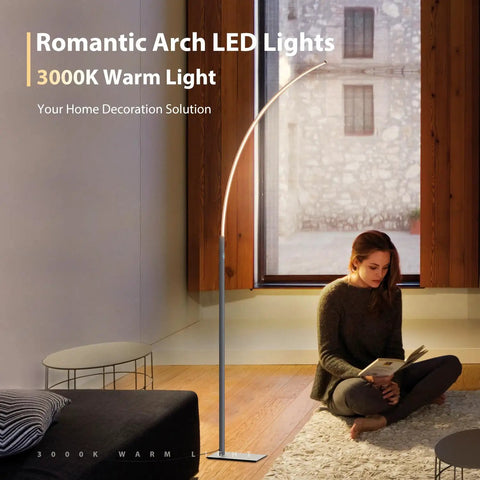 Arc Corner Floor Lamp With 3000K Warm White Cozy Vibes Mood Lighting in living room, sleek silver finish, woman reading on floor