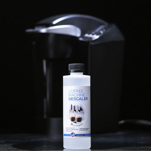 Descale Kit For Keurig 1.0 And 2.0 Coffee Makers And Espresso Machines bottle with coffee maker in background
