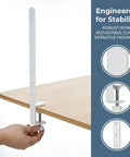 Side view of Two Piece White Adjustable Tablet Stand With Height Adjustable Iron Desk Brackets, showing clamp on wooden desk.