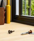 Stylish European Retro Clock Door Knobs In Antique Bronze Tone With Screws Perfect For Vintage Cabinet Hardware And Repair Projects That Give Your Space Serious Old World Charm And Sophistication. antique bronze cabinet knob with screw on desk