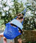 Child enjoying Heavy Duty Kids Rope Swing Seat For Indoor And Outdoor Play With Secure Hooks And Straps 440 Lb Capacity Blue