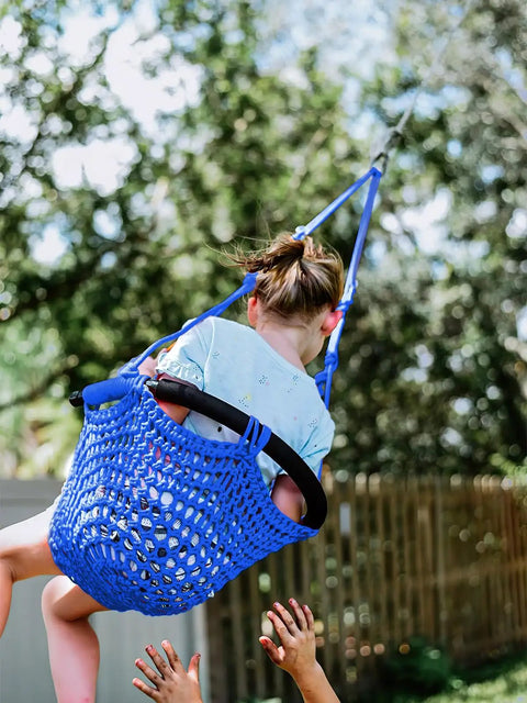 Child enjoying Heavy Duty Kids Rope Swing Seat For Indoor And Outdoor Play With Secure Hooks And Straps 440 Lb Capacity Blue