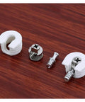 Interlocking Cam Lock Pins For DIY Furniture Kit, metal and plastic components on wood surface