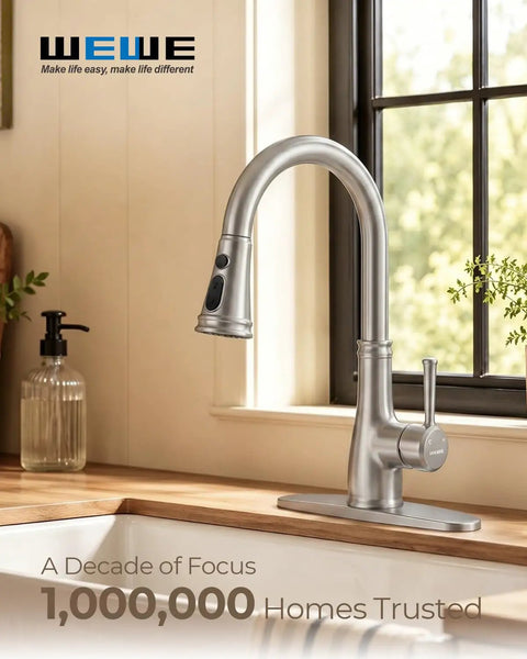 Vintage Kitchen Faucet With Pull Down Sprayer In Brushed Nickel Finish, featuring a high arc spout, installed in a modern kitchen.