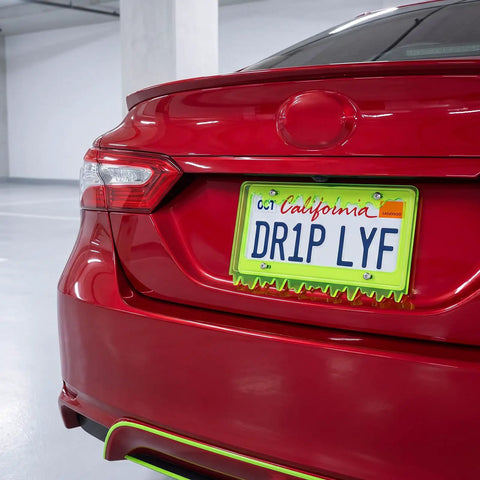 Red car with Glow In The Dark Dope Fluorescent Green Acrylic License Plate Frame With Screws Fits Standard 6x12 Inch Car Plates