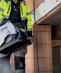Worker holding 14-Inch Metal Chop Saw With Quick Clamp And Variable Mitre For -15 To 45 Degree Cuts, Beast Mode Heavy Duty Cutter