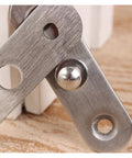 Close-up of self closing reversible door hinge with 360 degree hidden stainless steel construction for cabinets and furniture.