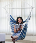 Woman reading in XXL Hammock Chair For Adults Large 70.9 By 47.2 Inch Swing Seat With 500 Lb Capacity Heavy Duty Steel Spreader Bar Extra Roomy Comfort