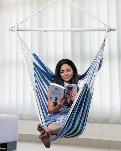 Woman reading in XXL Hammock Chair For Adults Large 70.9 By 47.2 Inch Swing Seat With 500 Lb Capacity Heavy Duty Steel Spreader Bar Extra Roomy Comfort