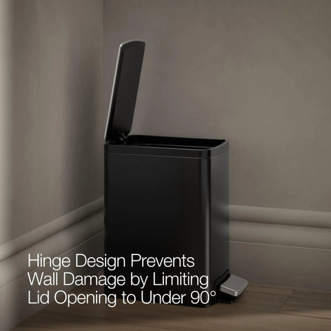 Black Stainless Small Trash Can With Foot Pedal And Quiet Close Lid 1.6 Gallon 6 Liter Fingerprint Resistant Stainless Steel Waste Bin placed against wall showcasing hinge design preventing wall damage.